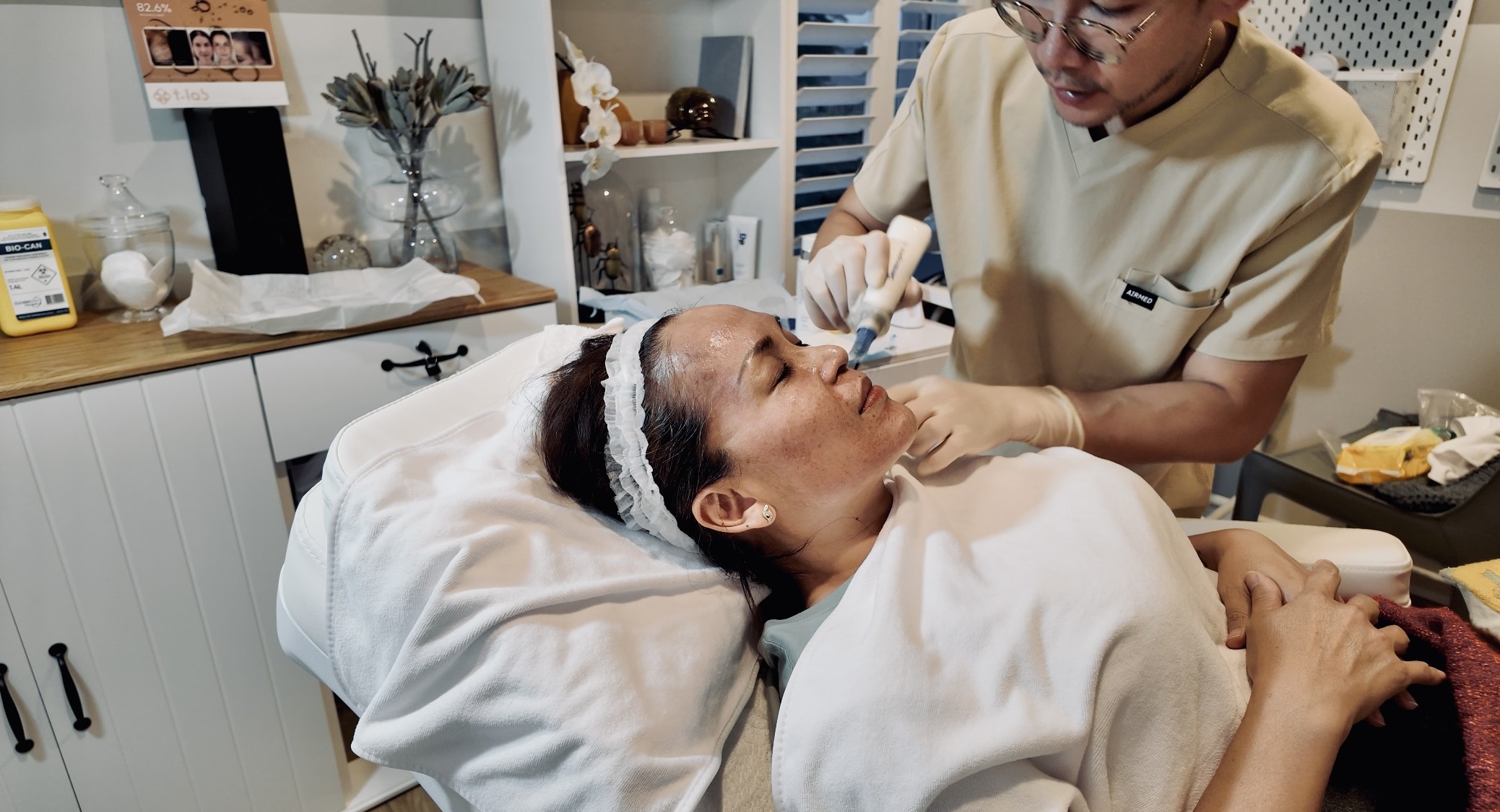 Close-up of microneedling pen device on skin